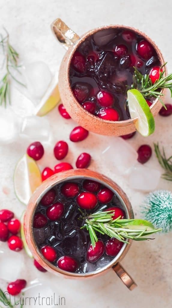 cranberry Moscow mule served in copper cups with ice, cranberries and lime