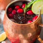 Cranberry Moscow Mule in copper cups with text overlay