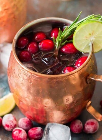 cranberry Moscow mule served in copper cups with ice, cranberries and lime