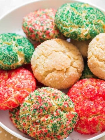 soft and chewey sugar cookies on white plate