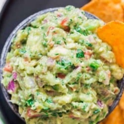 homemade guacamole dip served wiht nachos