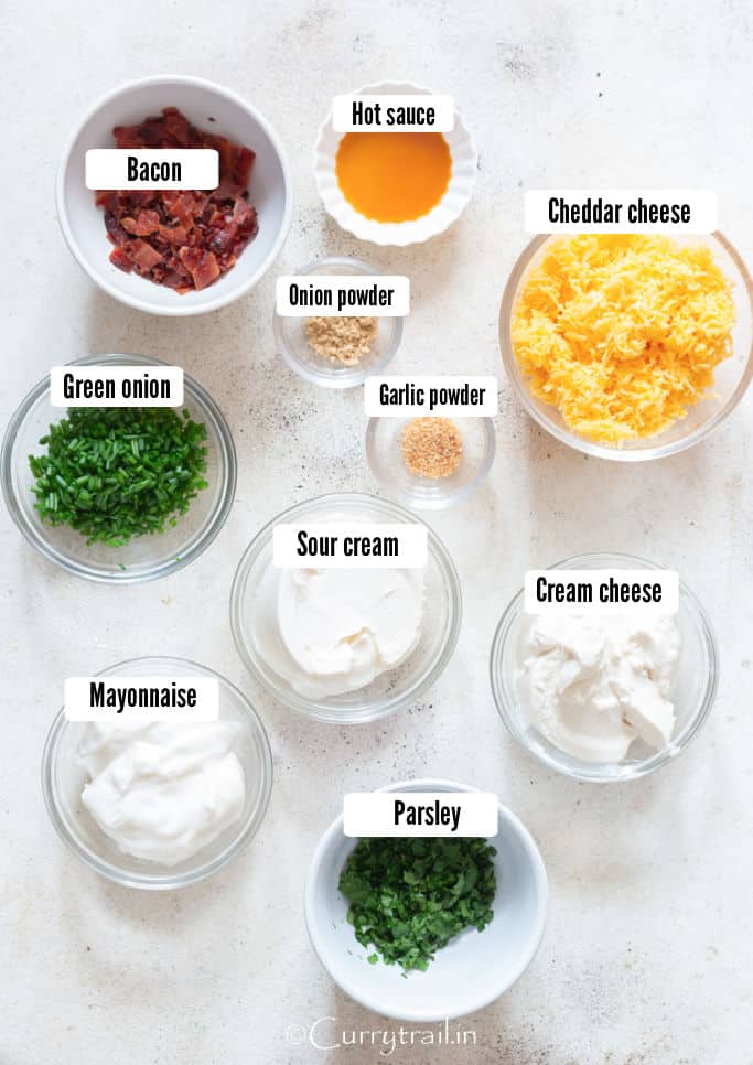 all the ingredients for cream cheese dip are arranged on a white table.