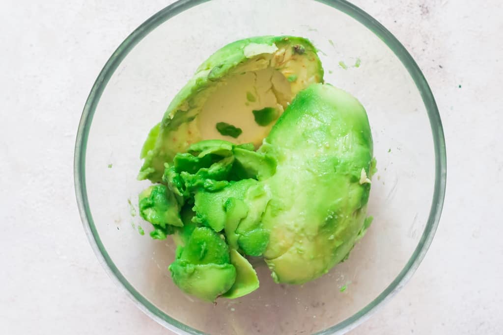 cut avocado in bowl