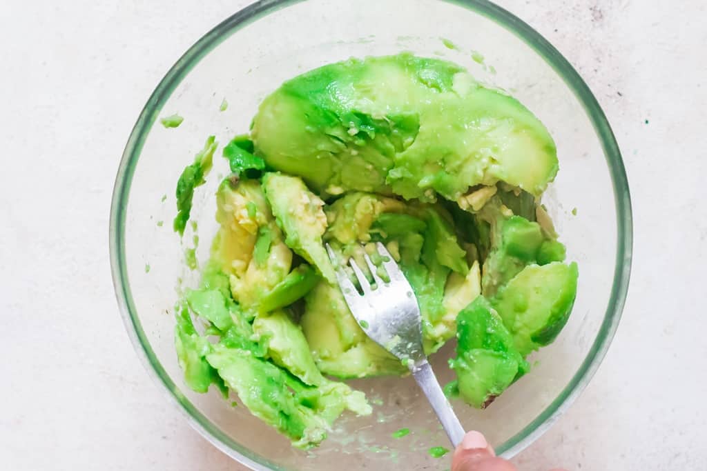 mash avocado with fork