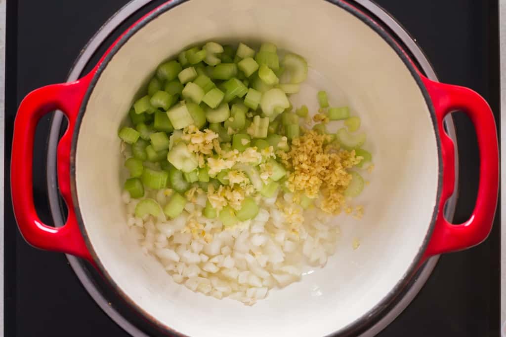 sauteing vegetables in soup pot in olive oil