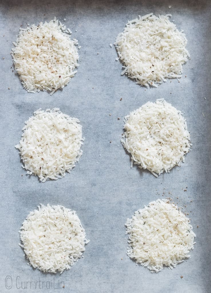 spread grated cheese on to baking tray