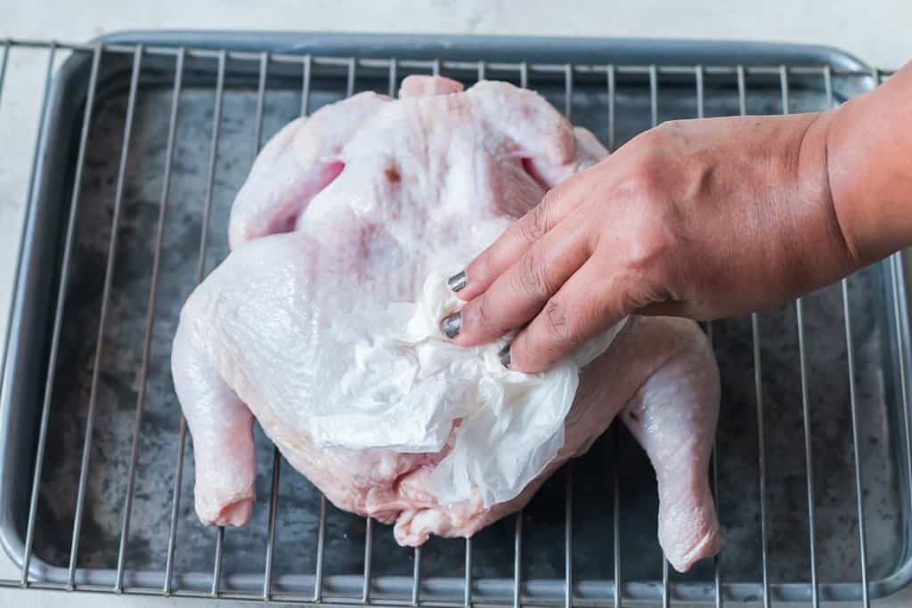 pat drying whole chicken