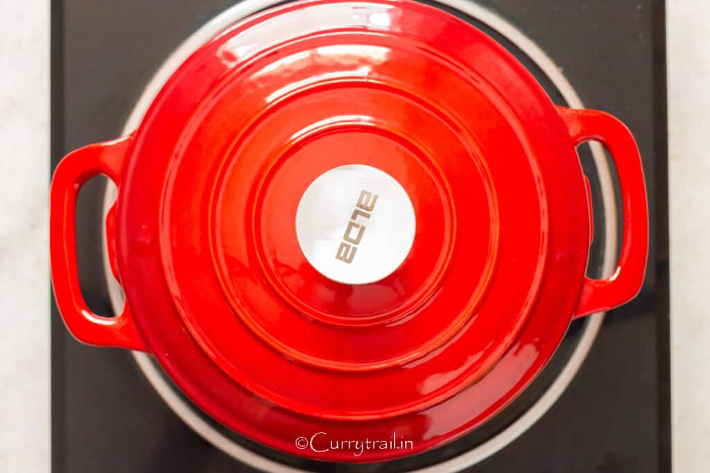 simmering browned lamb in chicken bone broth.