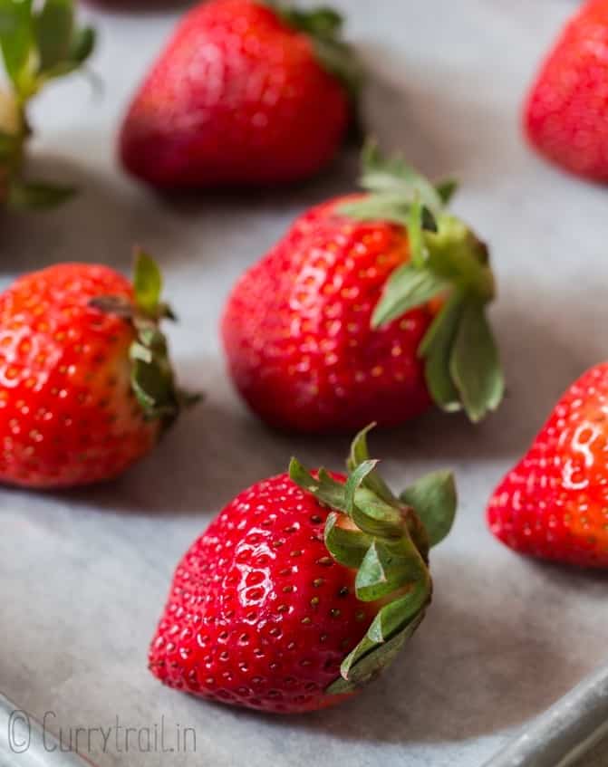 fresh strawberries on baking sheet