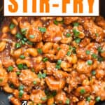 stir fried cashew chicken in wok with text overlay