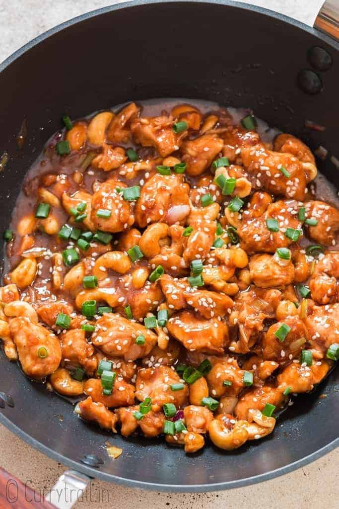 cashew chicken cooked in black wok