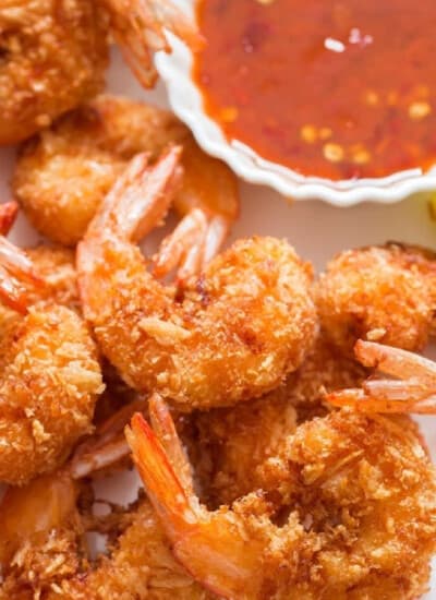 crispy coconut-crusted shrimp with red chili sauce for dipping.