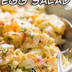 classic egg salad served in white bowl with spoon with text