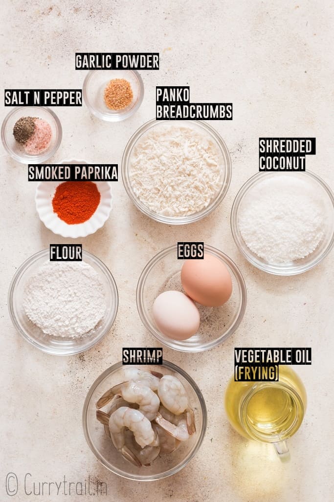 ingredients for coconut shrimp recipe arranged on board