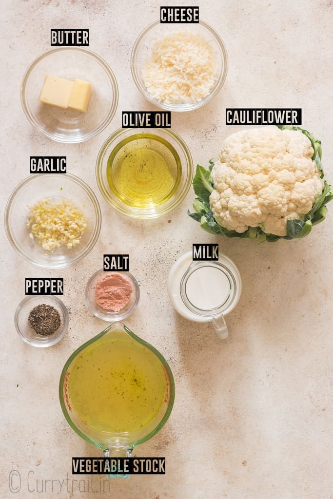 all ingredients for cauliflower cheese sauce on white board