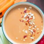 epic peanut sauce served in bowl with vegetable fingers