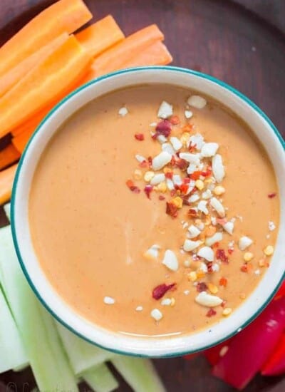 epic peanut sauce served in bowl with vegetable fingers