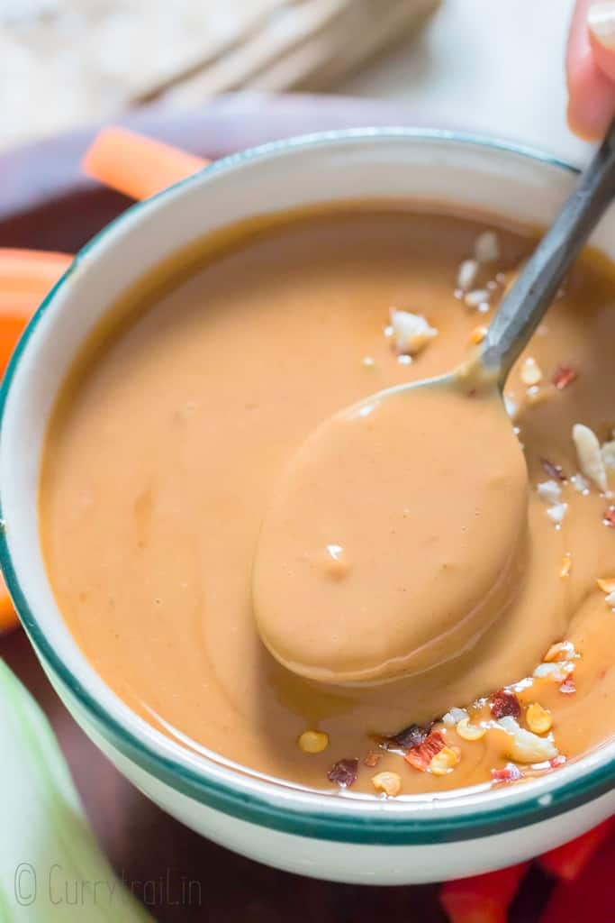 peanut sauce in a bowl with spoon