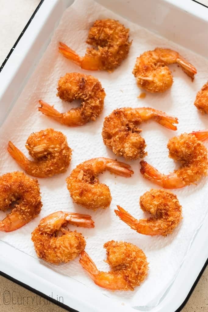 fried coconut shrimps on white tray