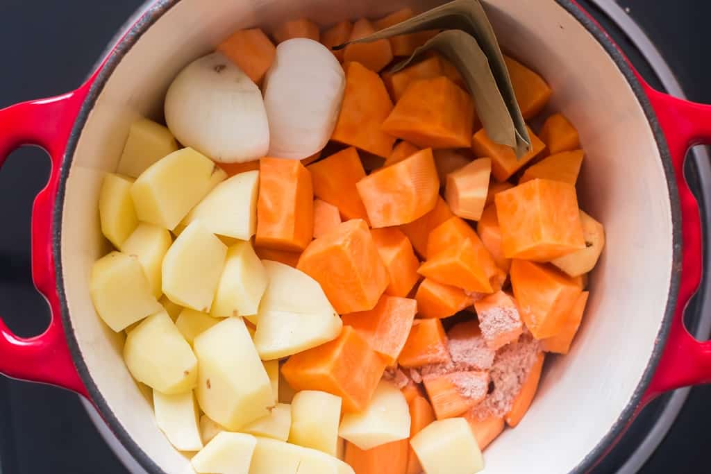 sweet potato and yukon potato added to cooking pot