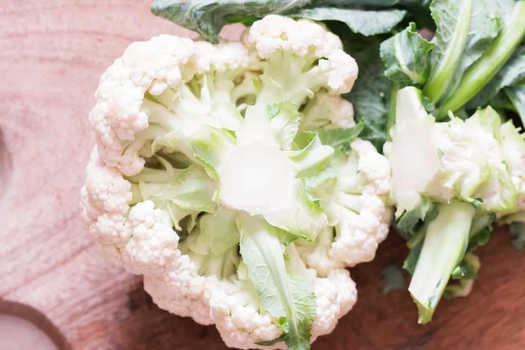 remove the green leafy stem from cauliflower head