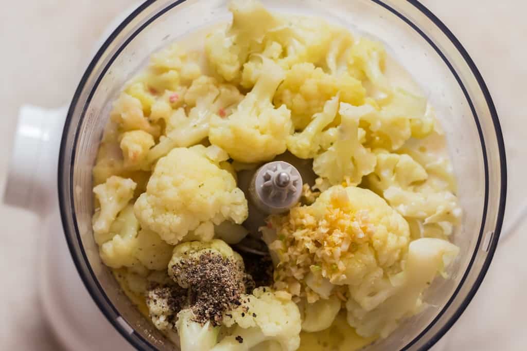 all ingredients added to food processor for cauliflower cheese sauce