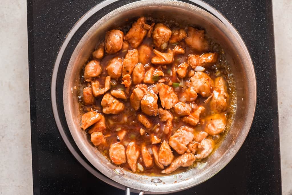 saucy cashew chicken in skillet