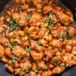 saucy cashew chicken cooked in black skillet