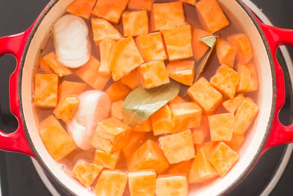 boiling potatoes in large pot to make sweet potato mash