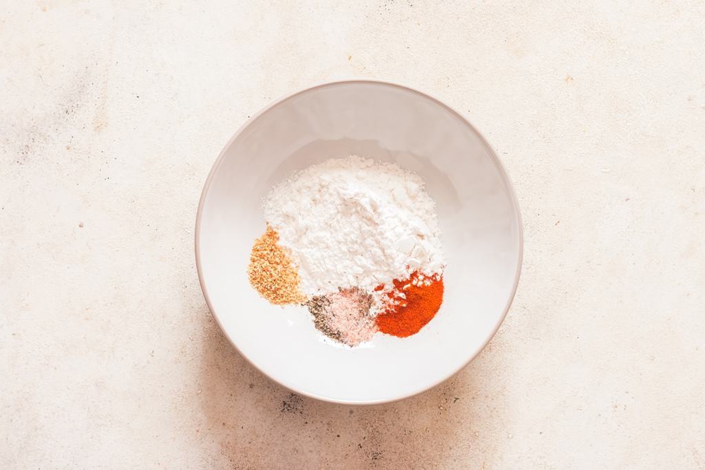 flour mixed with spices to coat coconut shrimp.