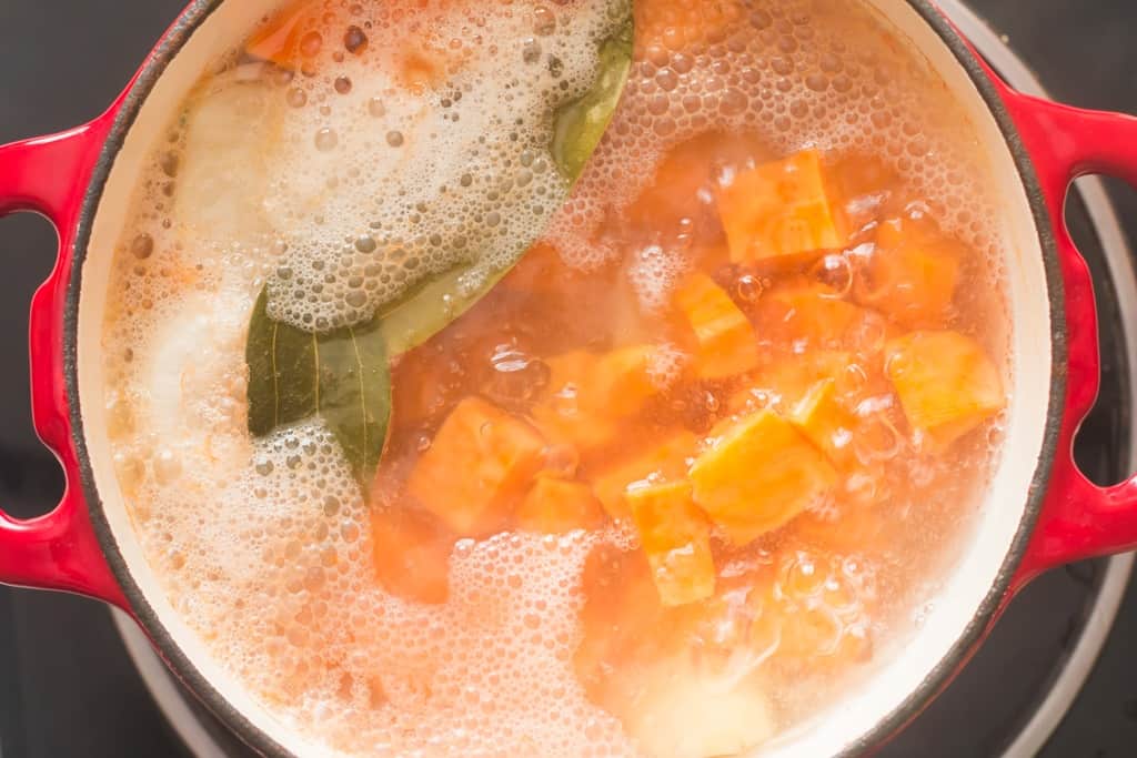 boiling potatoes in large pot to make mashed sweet potatoes