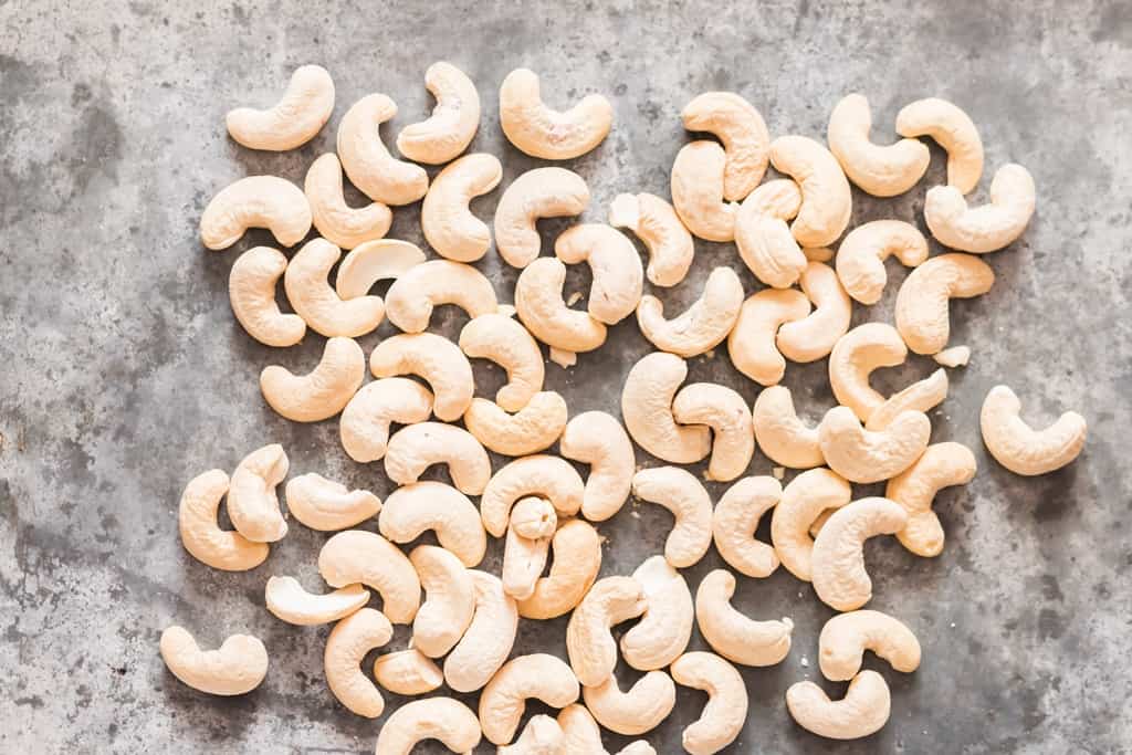 dry roast cashews in oven on bakign tray