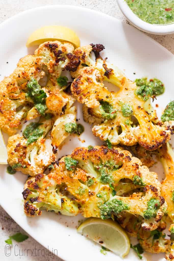 roasted cauliflower steaks with chimichurri sauce on side