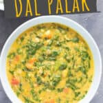 dal palak served in ceramic bowl with text overlay