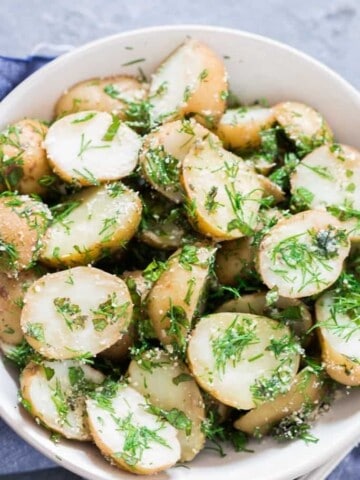no mayo easy potato salad with herbs served in a bowl