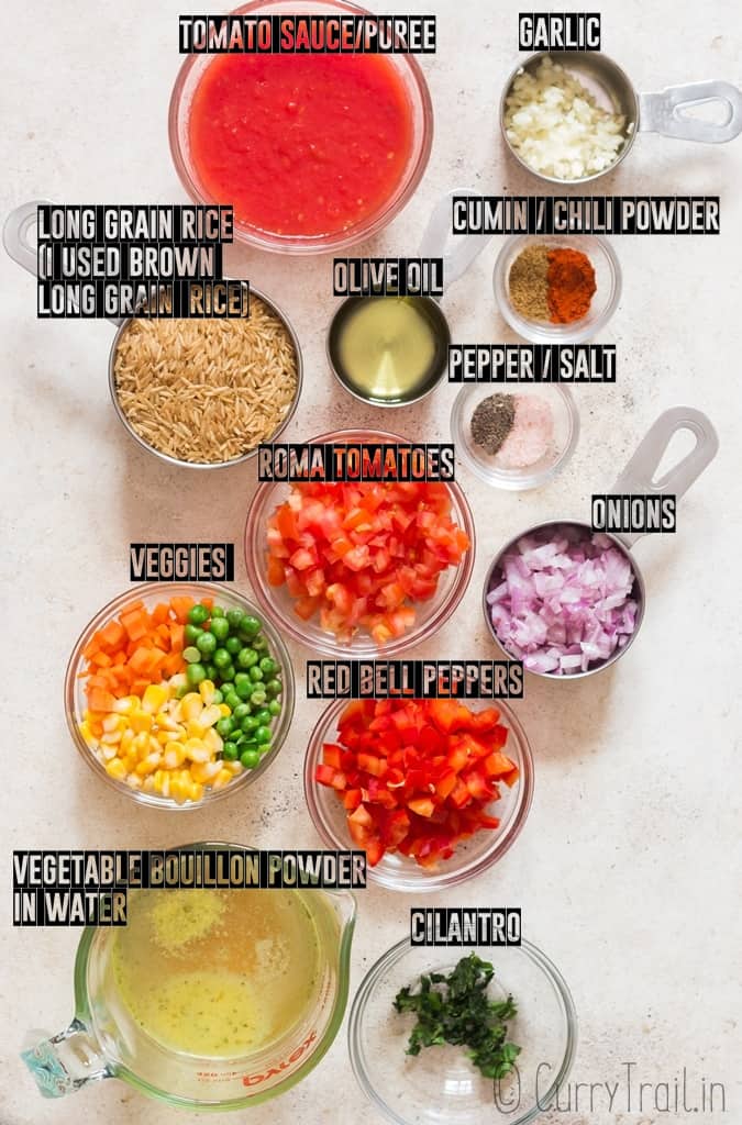 ingredients for instant pot mexican rice arranged on a board