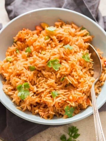 instant pot Mexican rice served in ceramic bowl garnished with cilantro