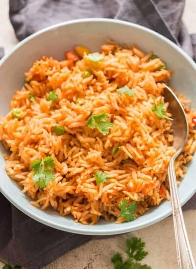 instant pot Mexican rice served in ceramic bowl garnished with cilantro