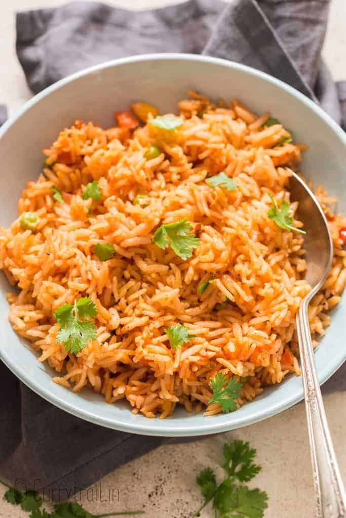 Instant pot Mexican rice served in ceramic bowl garnished with cilantro