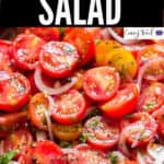 fresh tomato salad served in wooden salad bowl with text