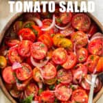 summer cherry tomato salad served in wooden salad bowl with text overlay