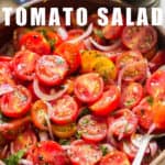 fresh cherry tomato salad in wooden bowl with text