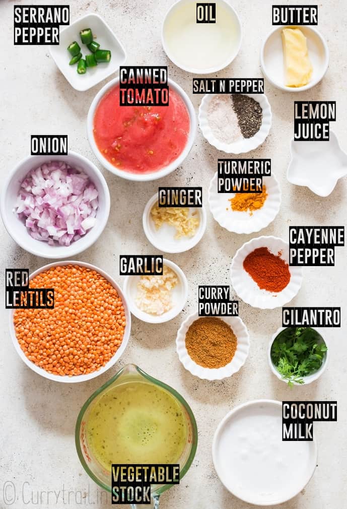 ingredients for coconut red lentil curry arranged on white board