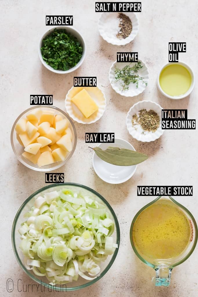 ingredients for potato and leek soup arranged on wooden tray