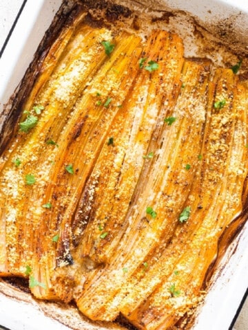 roasted leeks on a baking tray.