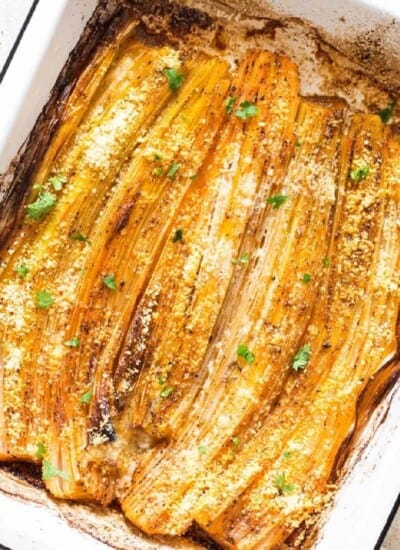 roasted leeks on a baking tray.