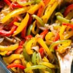 sauteed peppers and onions in a skillet