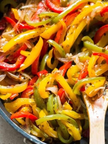 sauteed peppers and onions in a skillet