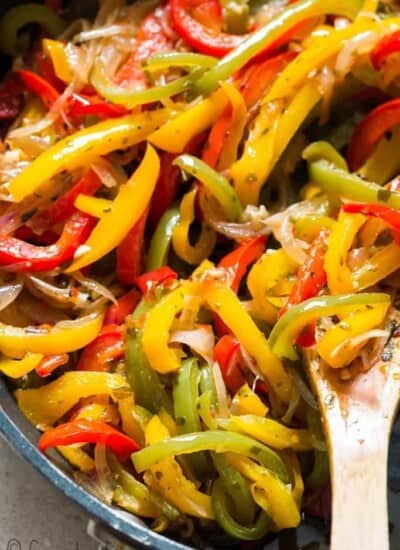 sauteed peppers and onions in a skillet