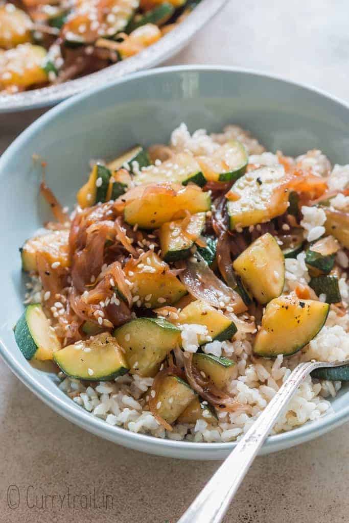 healthy Asian zucchini stir fry served over rice